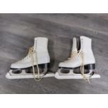 A pair of white leather ice skates - size 5