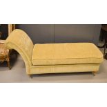 A chaise longue, with mahogany frame, upholstered in cream..