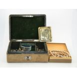 An antique brass buckle bearing the initial B, a leather jewellery box containing trinket box,