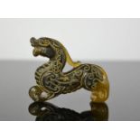 A Chinese natural jade hand carved dragon