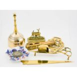 A group of antique and later brassware, including Victorian candle snuffers, nutcracker, a Victorian