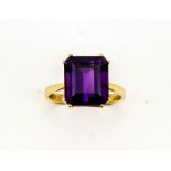 A 9ct gold and amethyst solitaire cocktail ring, the emerald cut amethyst, approx 6cts, size O, 4.