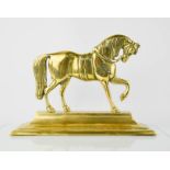 A Victorian brass door stop in the form of a horse,