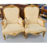 Two French giltwood 19th century style armchairs, with cream upholstery.