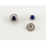 A pair of 9ct white gold, sapphire and diamond halo earrings.