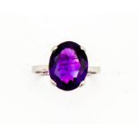 A 9ct white gold oval amethyst solitaire cocktail ring, approximately 4.5ct, size N, 3.4g.