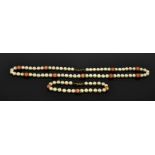 A 9ct gold, pearl and coral necklace and bracelet set, 31.2g.