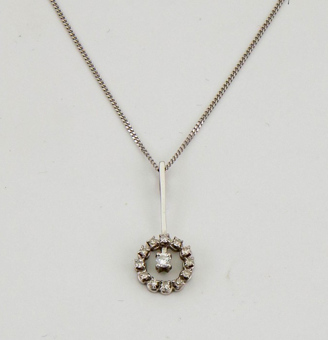 An 18ct white gold and diamond pendant necklace, in the French Art Deco style, with 9ct white gold