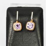 An 18ct rose gold amethyst and diamond earrings, the amethyst approx 2cts, the diamonds totalling