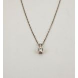 An 18ct white gold and diamond pendant necklace, the brilliant cut diamond approx 0.30cts, and a