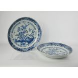 A pair of late 18th/early 19th century blue and white Chinese dishes, depicting butterflies in a