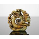 A Chinese natural jade handcarved statue/pendant of kneeling man with dragon on his back. 5cm by