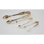 Three pairs of silver sugar tongs, London 1890, 1892, and 1864, 2.86cm.