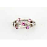 A platinum pink and white diamond set 'rain dance' style contemporary ring, size M½, pink diamond