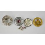 Four vintage Scottish brooches and a scarf clip.