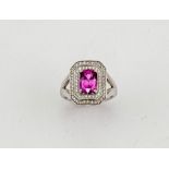 An 18ct white gold, pink sapphire and diamond ring, the sapphire approximately 2ct, the two