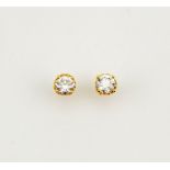 A pair of 18ct yellow gold and diamond solitaire earrings, the brilliant cut diamonds 1.5ct each,