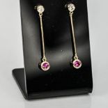 A pair of 9ct yellow gold diamond and ruby drop earrings.