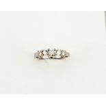 A platinum (tested but unhallmarked) five stone diamond ring, with graduated brilliant cut