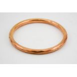 A 9ct gold bangle, faceted and hollow, 10.6g.