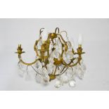 A gild brass French 1930s chandelier, with faceted drops and five branches, 43cm wide.