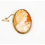 A 9ct gold cameo brooch, carved with a female profile portrait, the gold setting having a safety