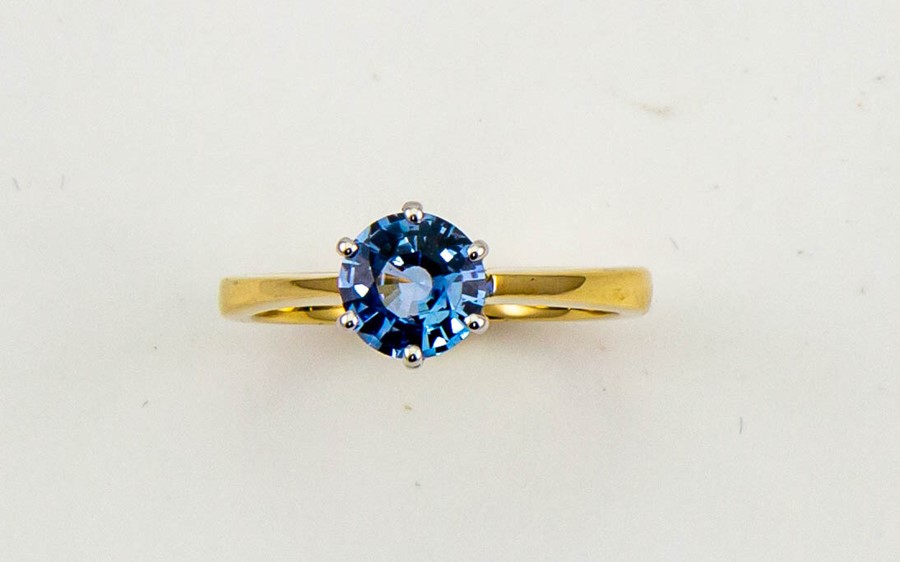 An 18ct yellow gold and sapphire solitaire ring, the brilliant cut sapphire approx 1.70cts, size