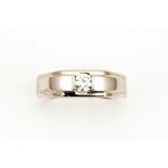 An 18ct white gold and diamond ring in a contemporary style, the diamond approx 0.25cts, size P, 4g.