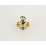 An 18ct gold, diamond and emerald ring in the Art Deco style, size O, 4.7g.