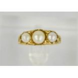 A 9ct gold and pearl ring, the Edwardian setting with three graduated pearls, size J, 4.5g.