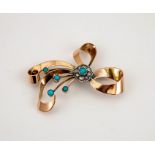 A large yellow metal (tested as 9ct) 1930s diamond and turquoise brooch, in the form of a bow, 6½