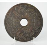 A vintage Chinese natural jade handcarved circular bi-plate dragon and phoenix 15cm wide