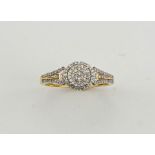 A 9ct gold and diamond cluster ring, 0.50ct diamonds, size R, 2.97g.