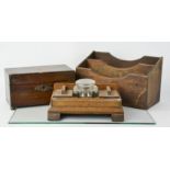 A 19th century tea caddy, a letter rack and an oak 1930s inkwell.