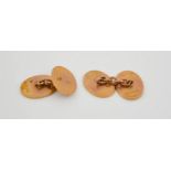 A pair of 9ct gold cufflinks, of plain oval form, 12.2g.