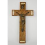 A Victorian corpus christi crucifix, in bronzed metal on a veneered wooden cross, 40 by 22cm.