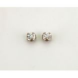 A pair of 18ct white gold and diamond solitaire earrings, 0.80ct each diamond, 1.6g.