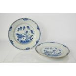 A pair of 19th century Chinese blue and white shallow dishes, depicting willow trees and peonies,