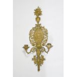 A cast brass wall sconce, with cherubs to the centre, two branches, 63cm high, 27cm wide.