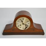 A 1930s mahogany cased mantle clock, inlaid with decoration, 16cm high.