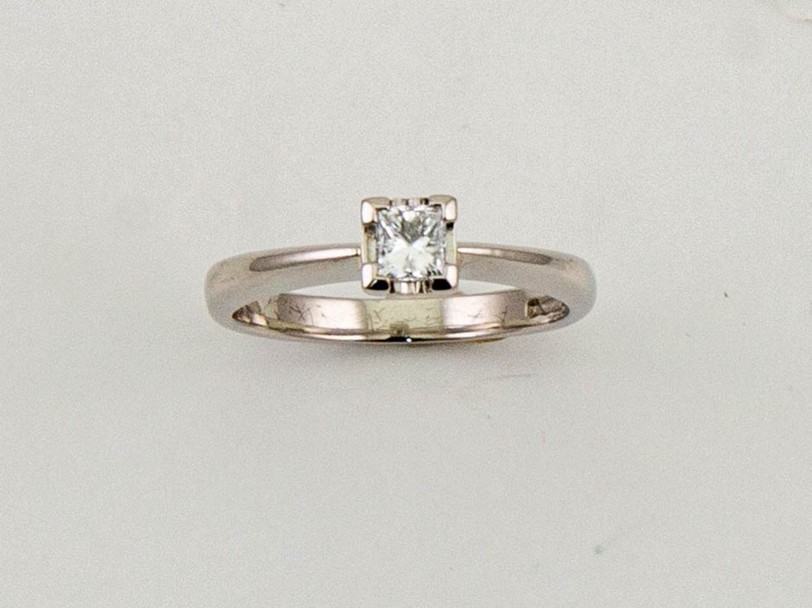 A platinum and diamond solitaire ring, the princess cut diamond approx 0.25ct, size L½, 4.4g.