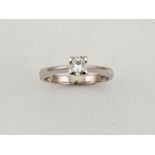A platinum and diamond solitaire ring, the princess cut diamond approx 0.25ct, size L½, 4.4g.