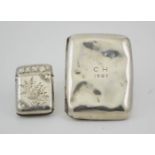 A silver vesta case with engraved floral decoration, together with a silver cigarette case