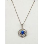 An 18ct white gold blue sapphire and diamond pendant necklace, the brilliant cut sapphire 1.19ct,