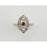 An 18ct white gold Art Deco style diamond and ruby ring, size N½, 3.8g.