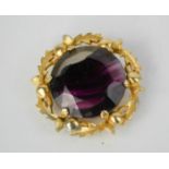 A vintage Scottish gilt thistle brooch with amethyst agate glass inset, indistinctly signed