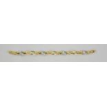 A Boodles 18ct yellow and white gold bracelet, the white gold oval segments set with diamonds,