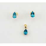 An 18ct yellow gold and blue topaz earrings, and matching pendant, set with pear cut topaz, 2.5g.