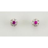 A pair of 18ct white gold, pink sapphire and diamond earrings, the pink sapphires total approx 0.