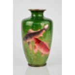 A late 19th / early 20th century Chinese enamelled vase depicting coy carp, on a graduated green